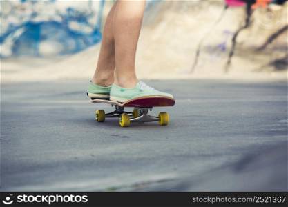 Young woman riding a skateboard