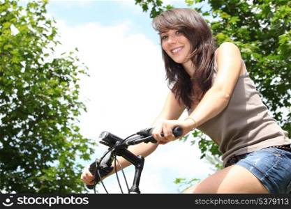young woman riding bicycle