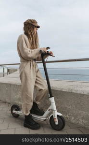 young woman riding electric scooter 10