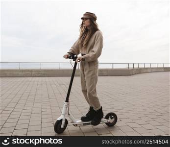 young woman riding electric scooter 11