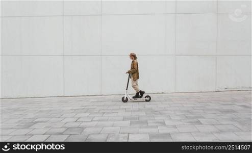 young woman riding electric scooter 14