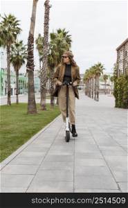 young woman riding electric scooter 17