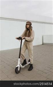 young woman riding electric scooter 21