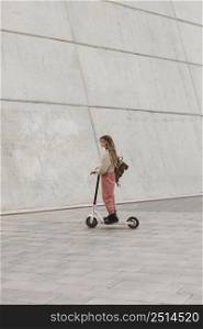 young woman riding electric scooter 27