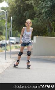 young woman riding roller skates