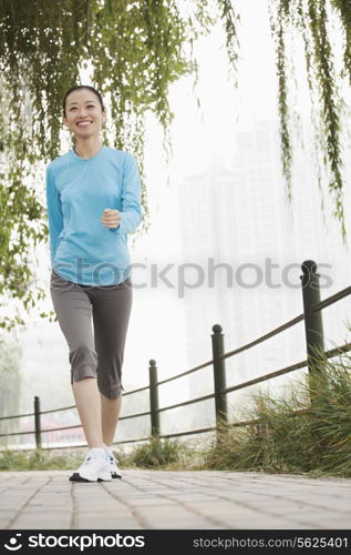 Young woman running in the park