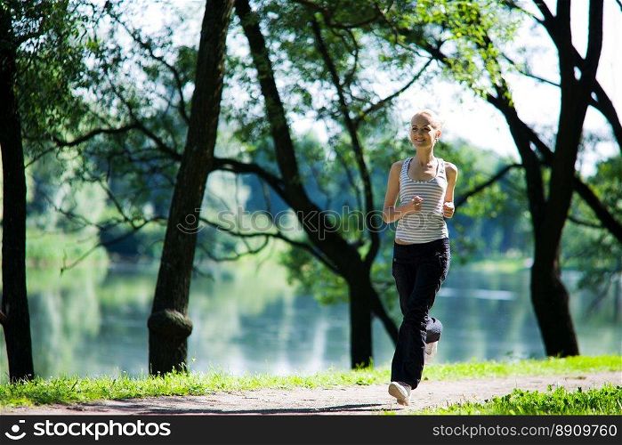 Young woman Running looking straight summer morning 