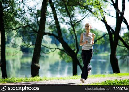 Young woman Running looking straight summer morning 
