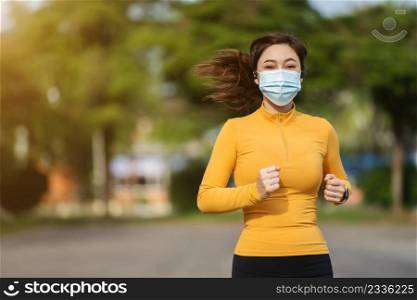 young woman running with medical mask to protect Coronavirus Covid-19  pandemic