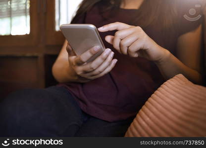 young woman searching a job in website on mobile smart phone