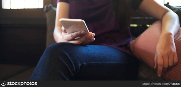 young woman searching a job in website on mobile smart phone