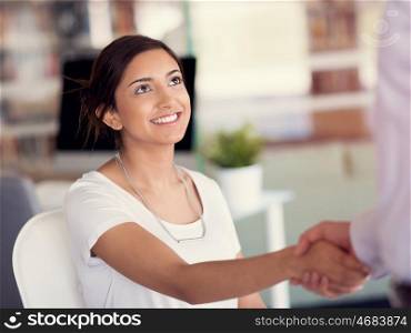 Young woman shaking hands with someone