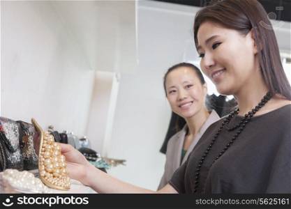 Young woman shopping for accessories at store