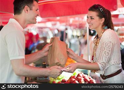 Young woman shopping for fruit
