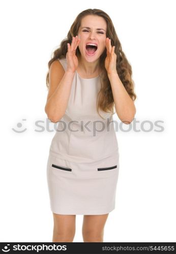 Young woman shouting through megaphone shaped hands
