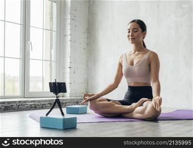 young woman showing meditation technique new vlog