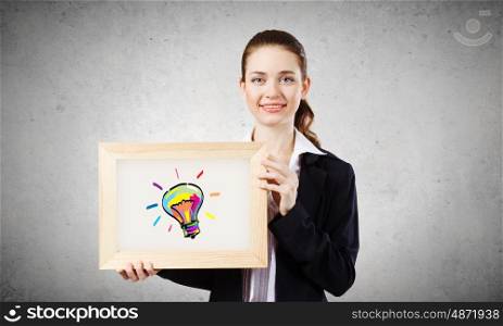 Young woman showing wooden frame with drawn bulb