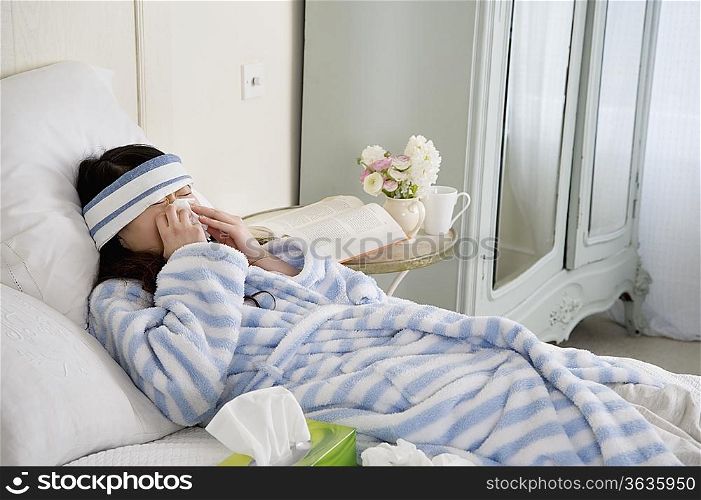 Young Woman Sick in Bed