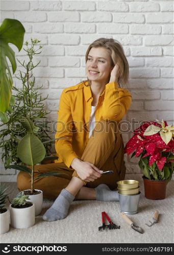 young woman sitting her home garden floor 2