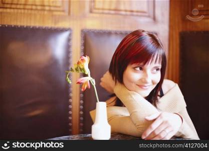 Young woman sitting in a restaurant