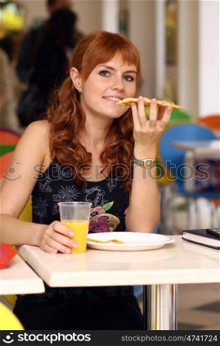 young woman sitting in a restaurant.