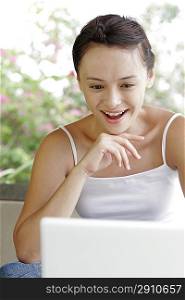 Young woman sitting in front of computer