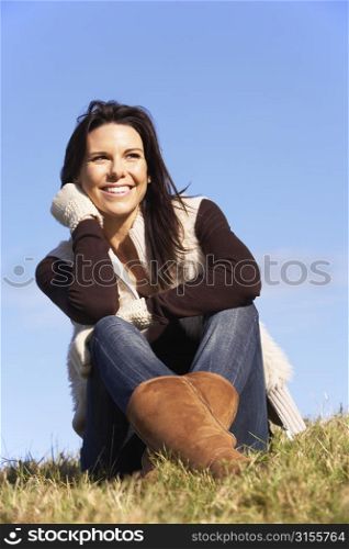 Young Woman Sitting In Park