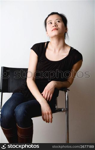 Young woman sitting on chair