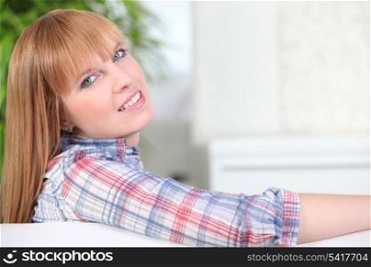 young woman sitting on the couch