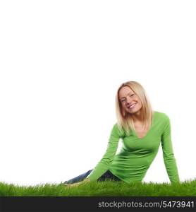 Young woman sitting on the grass, isolated on white background