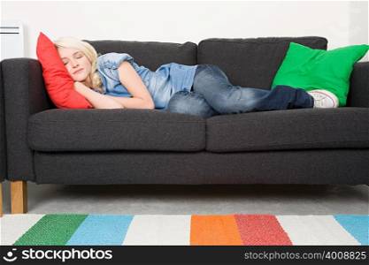 Young woman sleeping on a sofa