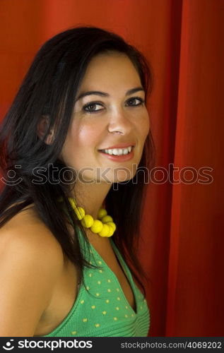 Young woman smiling, green dress