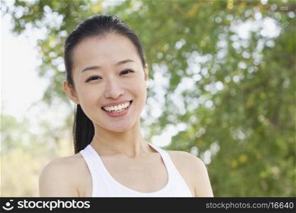 Young Woman Smiling in Park