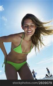 Young woman smiling on beach