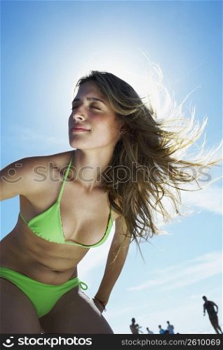 Young woman smiling on beach