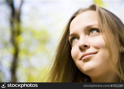 Young Woman Smiling Under The Sunlight
