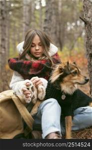 young woman spending time together with her dog forest 2