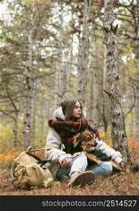 young woman spending time together with her dog outside