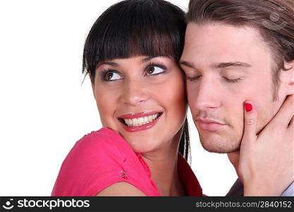 Young woman squeezing her boyfriend