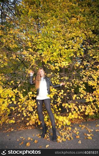 Young woman stand autumn leaves fall yellow green girl garden background