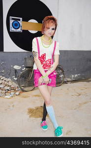 Young woman standing in a street, Zhengzhou, Henan Province, China