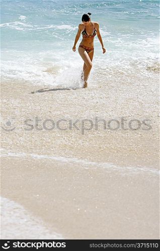 Young woman standing in the sea