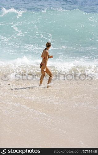 Young woman standing in the sea