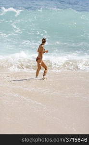 Young woman standing in the sea