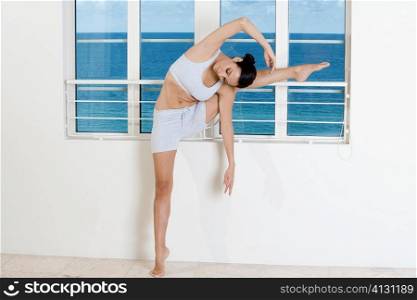 Young woman stretching