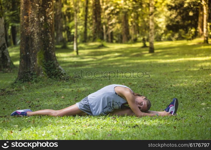 Young woman stretching before Fitness