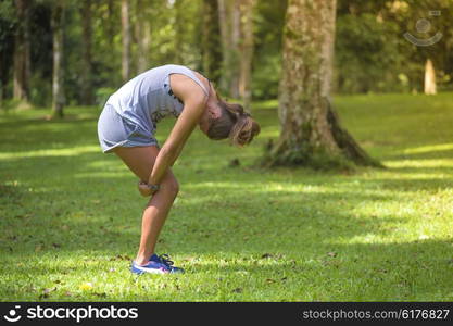 Young woman stretching before Fitness