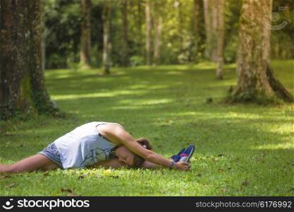 Young woman stretching before Fitness