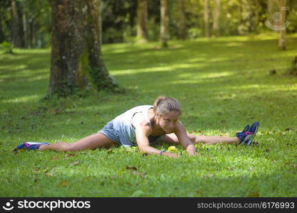 Young woman stretching before Fitness