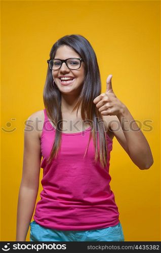 Young woman student with thumbs up